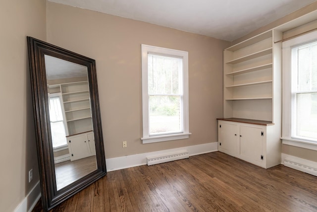 3804 Portage St, Kalamazoo, MI 49001 - spare room with a baseboard heating unit and dark wood finished floors