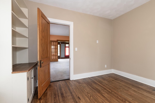 3804 Portage St, Kalamazoo, MI 49001 - empty room featuring dark wood-style flooring and baseboards