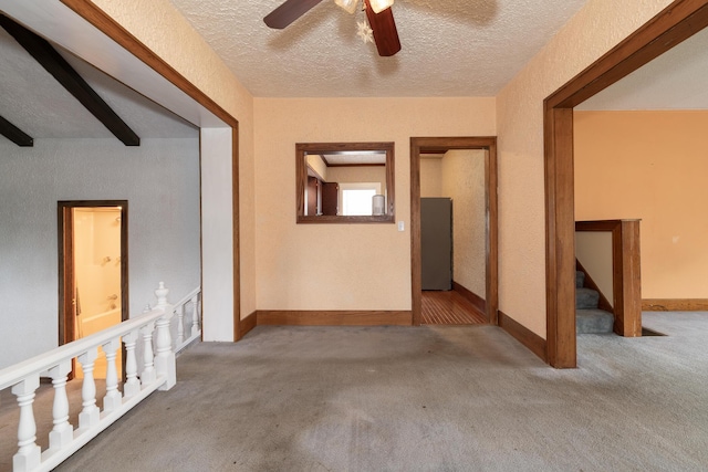 3804 Portage St, Kalamazoo, MI 49001 - unfurnished room featuring a textured ceiling, carpet, a ceiling fan, and stairway