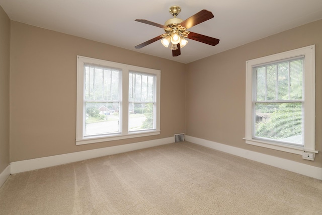 3804 Portage St, Kalamazoo, MI 49001 - carpeted spare room featuring baseboards and a ceiling fan