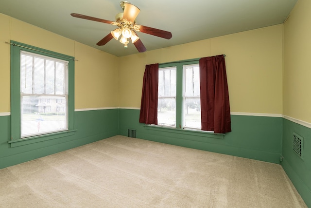 3804 Portage St, Kalamazoo, MI 49001 - carpeted empty room with a ceiling fan