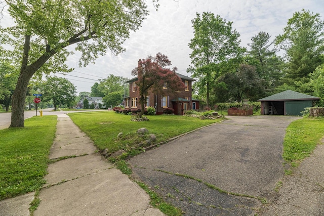3804 Portage St, Kalamazoo, MI 49001 - view of property exterior featuring a yard and asphalt driveway