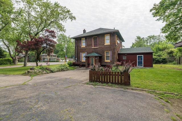 3804 Portage St, Kalamazoo, MI 49001 - traditional style home with a chimney, driveway, and brick siding