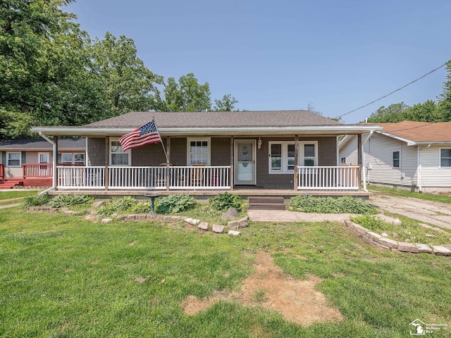 9601 Exeter Rd, Carleton, MI 48117 - ranch-style home with covered porch, a front yard, and roof with shingles