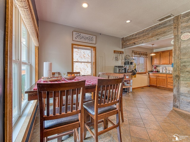 9601 Exeter Rd, Carleton, MI 48117 - dining area with healthy amount of natural light, a textured ceiling, recessed lighting, and beam ceiling