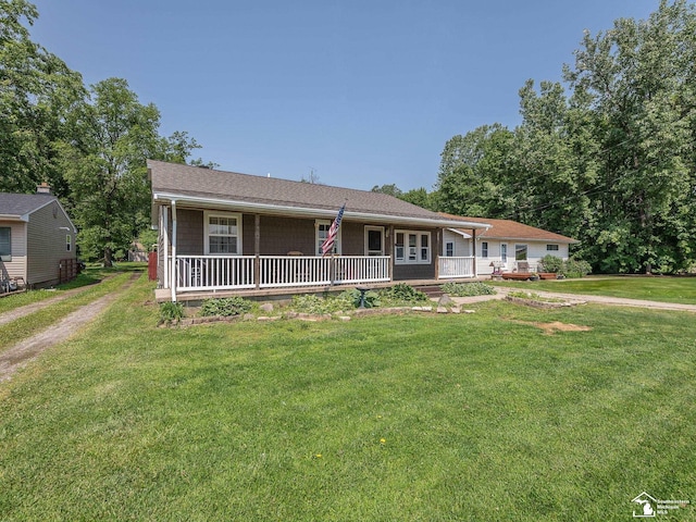 9601 Exeter Rd, Carleton, MI 48117 - ranch-style home with a front yard and covered porch