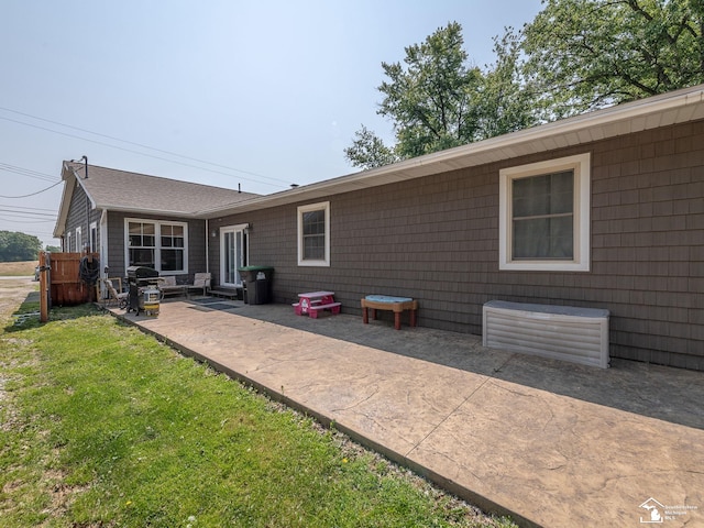 9601 Exeter Rd, Carleton, MI 48117 - rear view of house with a patio and a lawn