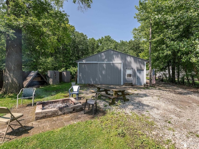 9601 Exeter Rd, Carleton, MI 48117 - view of pole building featuring a fire pit