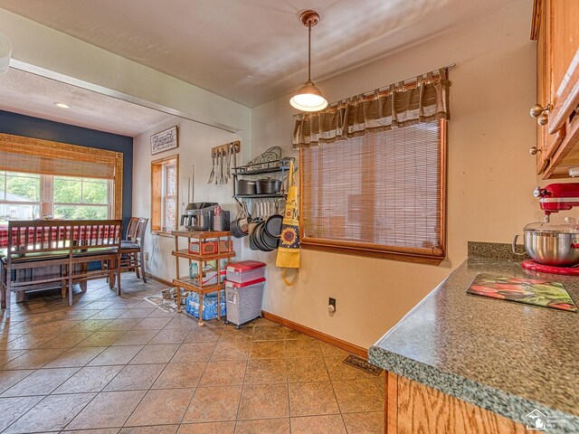 9601 Exeter Rd, Carleton, MI 48117 - dining space featuring baseboards and light tile patterned floors