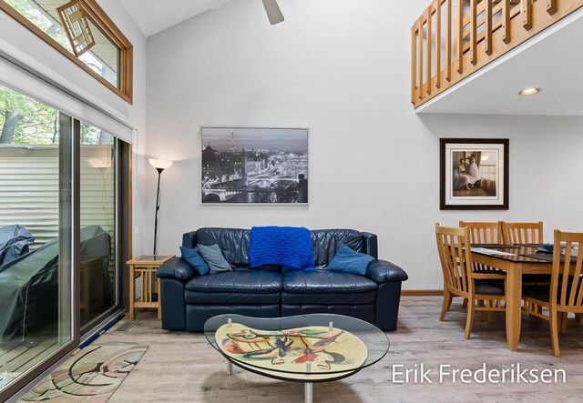 17879 Hidden Dunes Ln Unit D, Spring Lake, MI 49456 - living area with high vaulted ceiling, wood finished floors, baseboards, and a ceiling fan