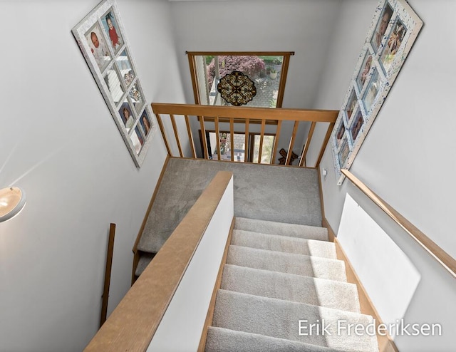 17879 Hidden Dunes Ln Unit D, Spring Lake, MI 49456 - staircase with a towering ceiling