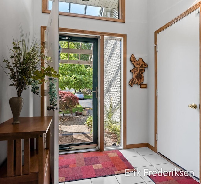 17879 Hidden Dunes Ln Unit D, Spring Lake, MI 49456 - foyer entrance featuring light tile patterned floors and baseboards