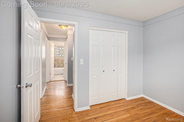 7612 Clippert St, Taylor, MI 48180 - unfurnished bedroom featuring light wood finished floors, baseboards, and a closet