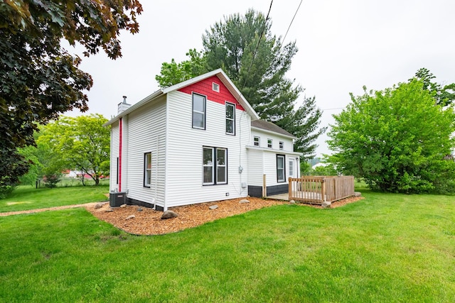 15551 Mason St, Union, MI 49130 - back of property featuring a chimney, a yard, a deck, and central AC unit