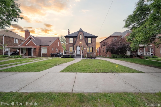 17157 Mendota St, Detroit, MI 48221 - tudor-style house featuring brick siding and a lawn