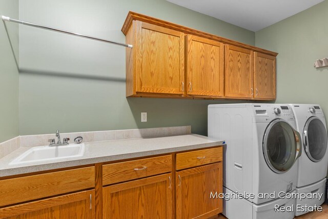4349 Walter Rd, Wayland, MI 49348 - laundry room with cabinet space and washer and clothes dryer