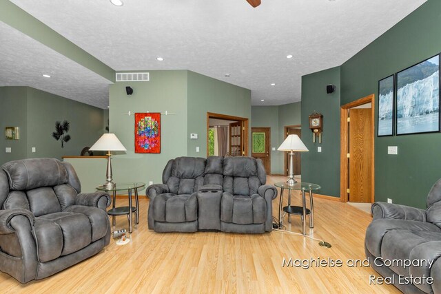 4349 Walter Rd, Wayland, MI 49348 - living room with wood finished floors, recessed lighting, a textured ceiling, and a ceiling fan