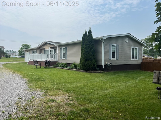 5550 Howe Rd, Grand Blanc, MI 48439 - view of home's exterior featuring driveway and an attached garage