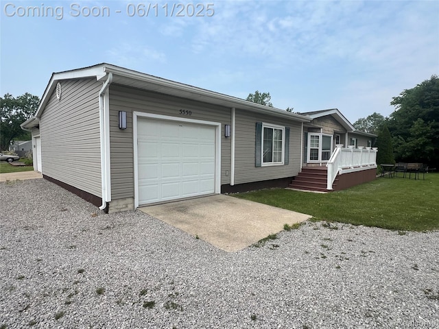 5550 Howe Rd, Grand Blanc, MI 48439 - view of front of property featuring an attached garage, a front lawn, driveway, and a wooden deck