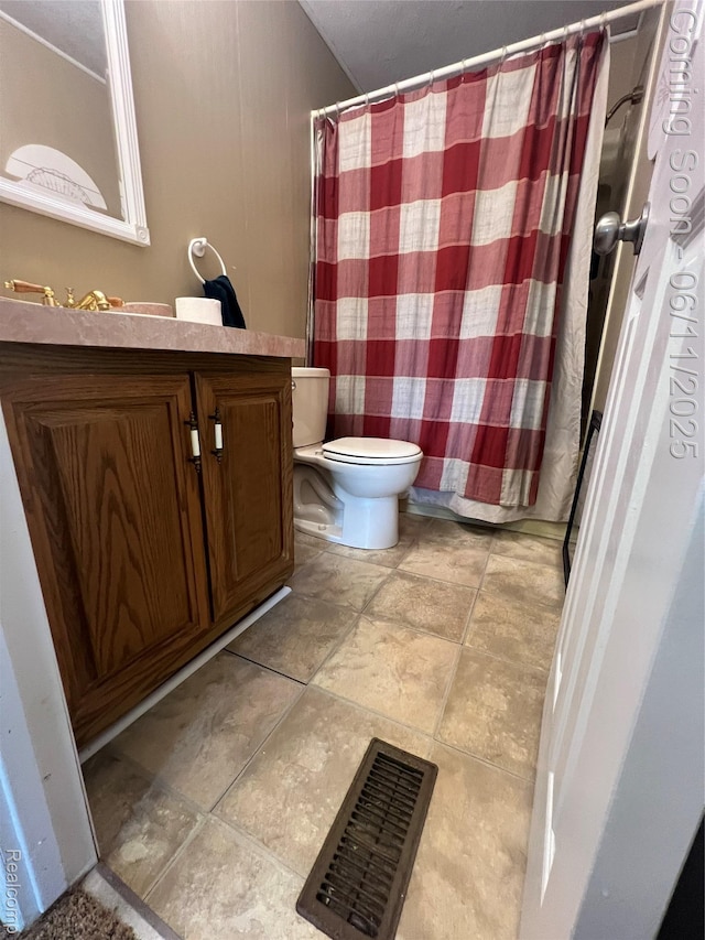 5550 Howe Rd, Grand Blanc, MI 48439 - bathroom with toilet, vanity, tile patterned flooring, and a shower with shower curtain