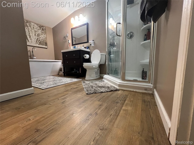 5550 Howe Rd, Grand Blanc, MI 48439 - full bath with vanity, a shower stall, wood finished floors, a soaking tub, and toilet