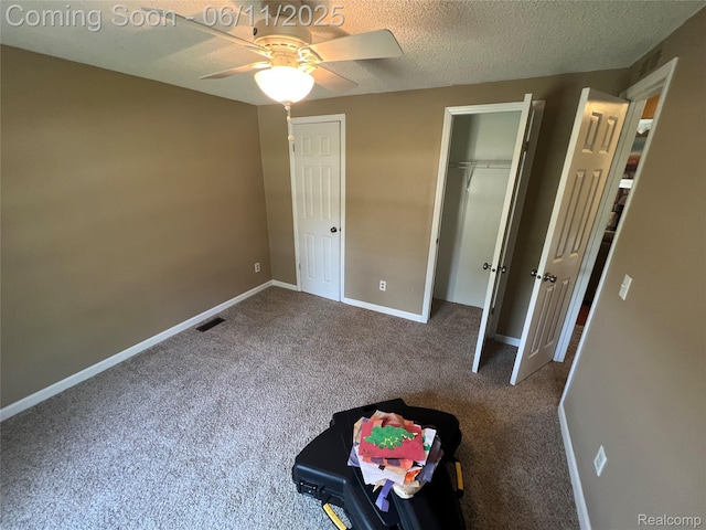 5550 Howe Rd, Grand Blanc, MI 48439 - unfurnished bedroom featuring carpet floors, baseboards, a textured ceiling, and a ceiling fan