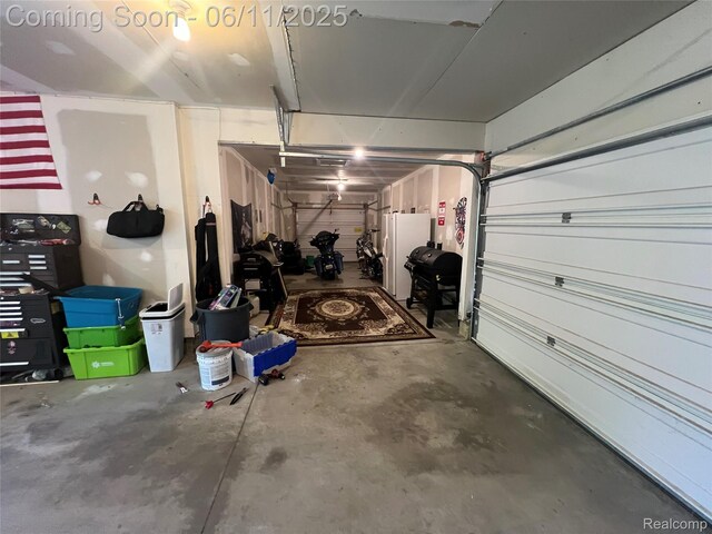 5550 Howe Rd, Grand Blanc, MI 48439 - garage with freestanding refrigerator