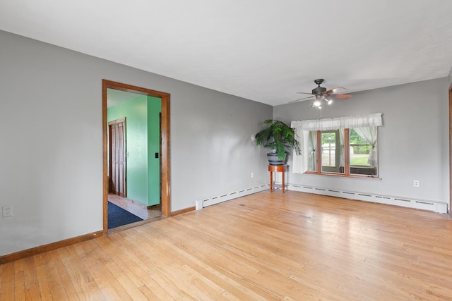 5244 Sand Creek Highway, Adrian, MI 49221 - empty room featuring ceiling fan, wood-type flooring, baseboards, and baseboard heating