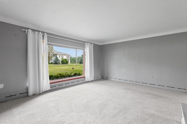5244 Sand Creek Highway, Adrian, MI 49221 - spare room featuring light carpet, baseboard heating, and a baseboard heating unit