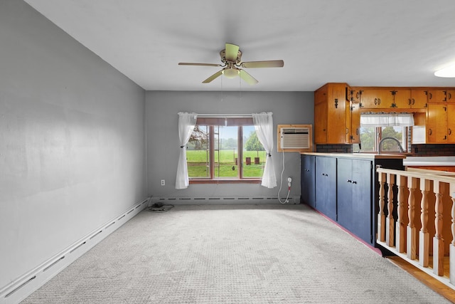 5244 Sand Creek Highway, Adrian, MI 49221 - kitchen featuring an AC wall unit, a ceiling fan, baseboard heating, and light carpet