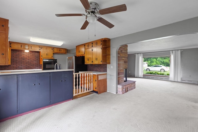 5244 Sand Creek Highway, Adrian, MI 49221 - kitchen with oven, light carpet, open shelves, a fireplace with raised hearth, and light countertops