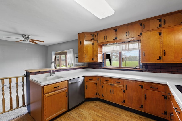 5244 Sand Creek Highway, Adrian, MI 49221 - kitchen with dishwasher, a sink, tasteful backsplash, a peninsula, and light countertops