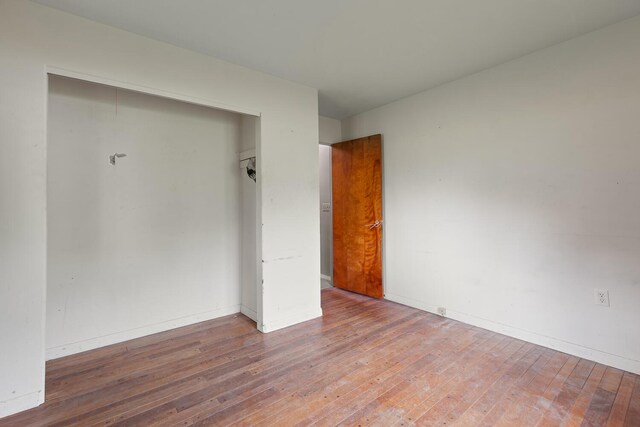 5244 Sand Creek Highway, Adrian, MI 49221 - unfurnished room with wood-type flooring and baseboards