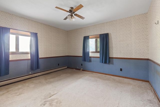 5244 Sand Creek Highway, Adrian, MI 49221 - spare room with wallpapered walls, a ceiling fan, wainscoting, carpet, and baseboards