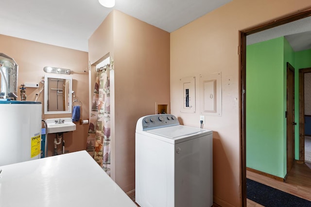 5244 Sand Creek Highway, Adrian, MI 49221 - washroom featuring washer / dryer, water heater, and wood finished floors