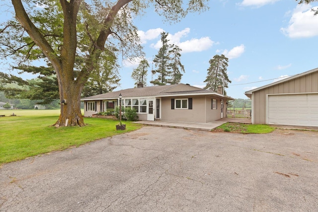 5244 Sand Creek Highway, Adrian, MI 49221 - ranch-style home with a front lawn and a chimney