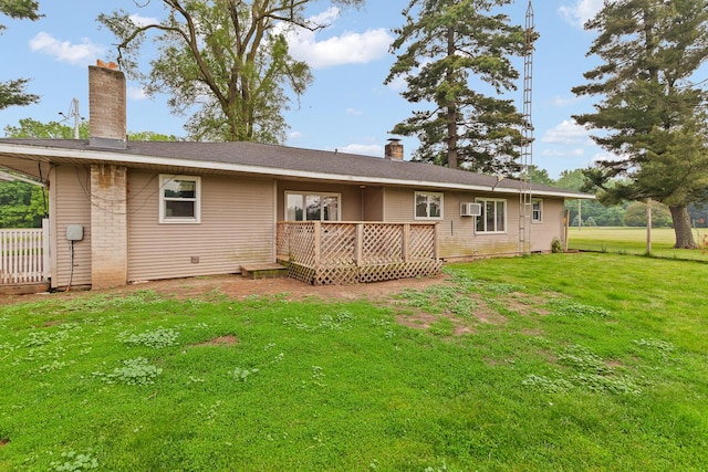 5244 Sand Creek Highway, Adrian, MI 49221 - back of house featuring a chimney, a deck, a yard, and a wall mounted air conditioner