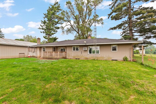 5244 Sand Creek Highway, Adrian, MI 49221 - rear view of house with a lawn, a deck, and an AC wall unit