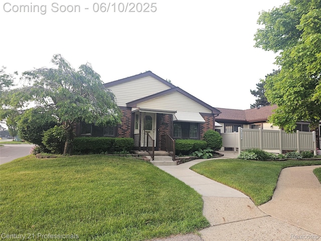 40859 Newport Dr, Plymouth, MI 48170 - view of front facade with brick siding and a front yard