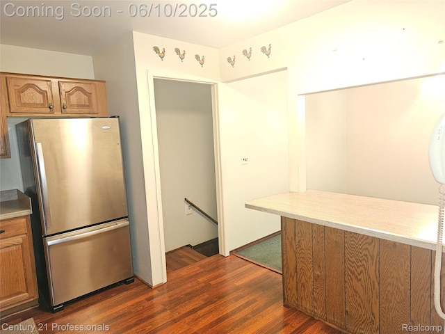 40859 Newport Dr, Plymouth, MI 48170 - kitchen featuring freestanding refrigerator, dark wood-style flooring, light countertops, and brown cabinetry