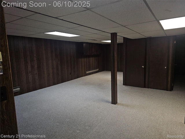 40859 Newport Dr, Plymouth, MI 48170 - finished below grade area featuring carpet, a drop ceiling, wood walls, and a baseboard radiator