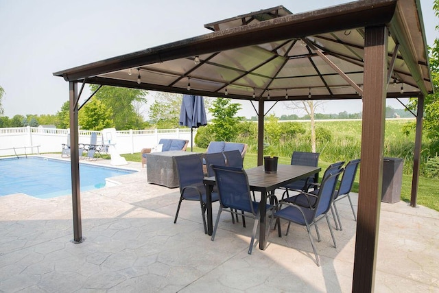 13952 Stowell Rd, Dundee, MI 48131 - fenced backyard with a gazebo, a patio area, and outdoor dining area