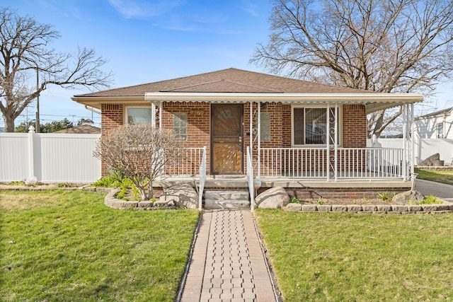 7369 Helen, Center Line, MI 48015 - view of front of house with covered porch, brick siding, and a shingled roof