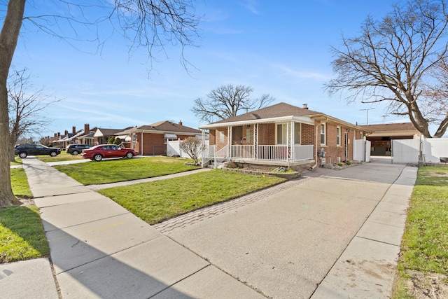 7369 Helen, Center Line, MI 48015 - view of front of house with brick siding, a porch, driveway, and a chimney