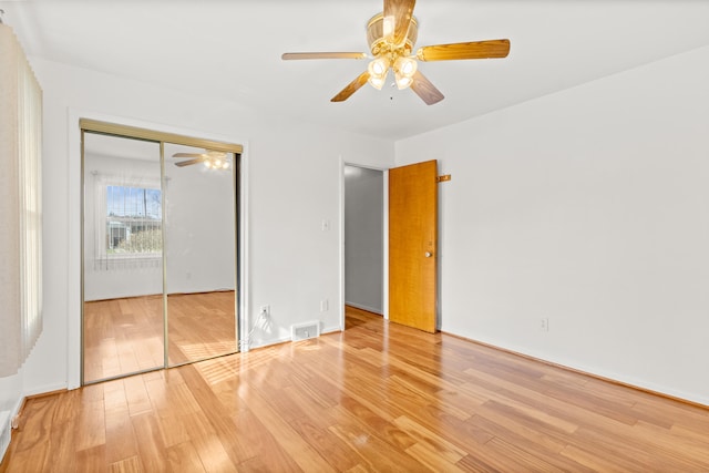 7369 Helen, Center Line, MI 48015 - unfurnished bedroom featuring light wood finished floors, a closet, ceiling fan, and baseboards