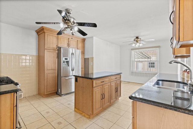7369 Helen, Center Line, MI 48015 - kitchen featuring appliances with stainless steel finishes, ceiling fan, a sink, a kitchen island, and light tile patterned flooring