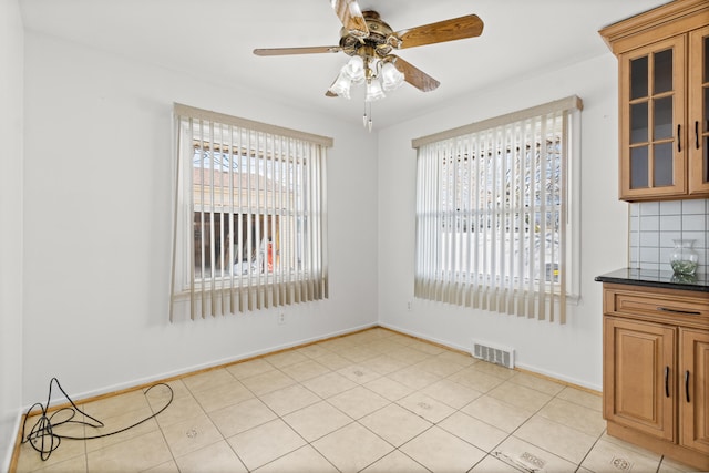 7369 Helen, Center Line, MI 48015 - unfurnished dining area featuring baseboards and a ceiling fan