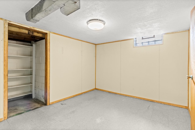 7369 Helen, Center Line, MI 48015 - basement with light flooring, a textured ceiling, and baseboards