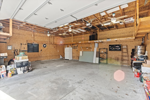 7369 Helen, Center Line, MI 48015 - garage featuring freestanding refrigerator, a garage door opener, and ceiling fan