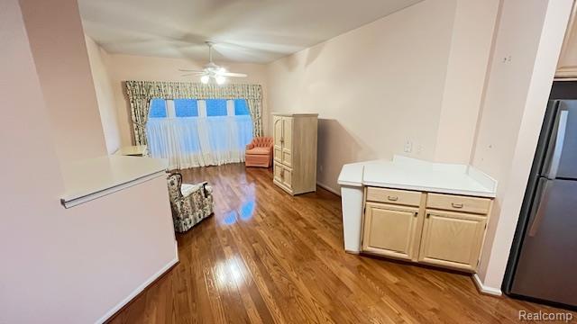 43573 E Perignon Dr N, Sterling Heights, MI 48314 - kitchen with freestanding refrigerator, ceiling fan, wood finished floors, and light countertops
